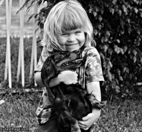 Little Girl With Cute Puppy